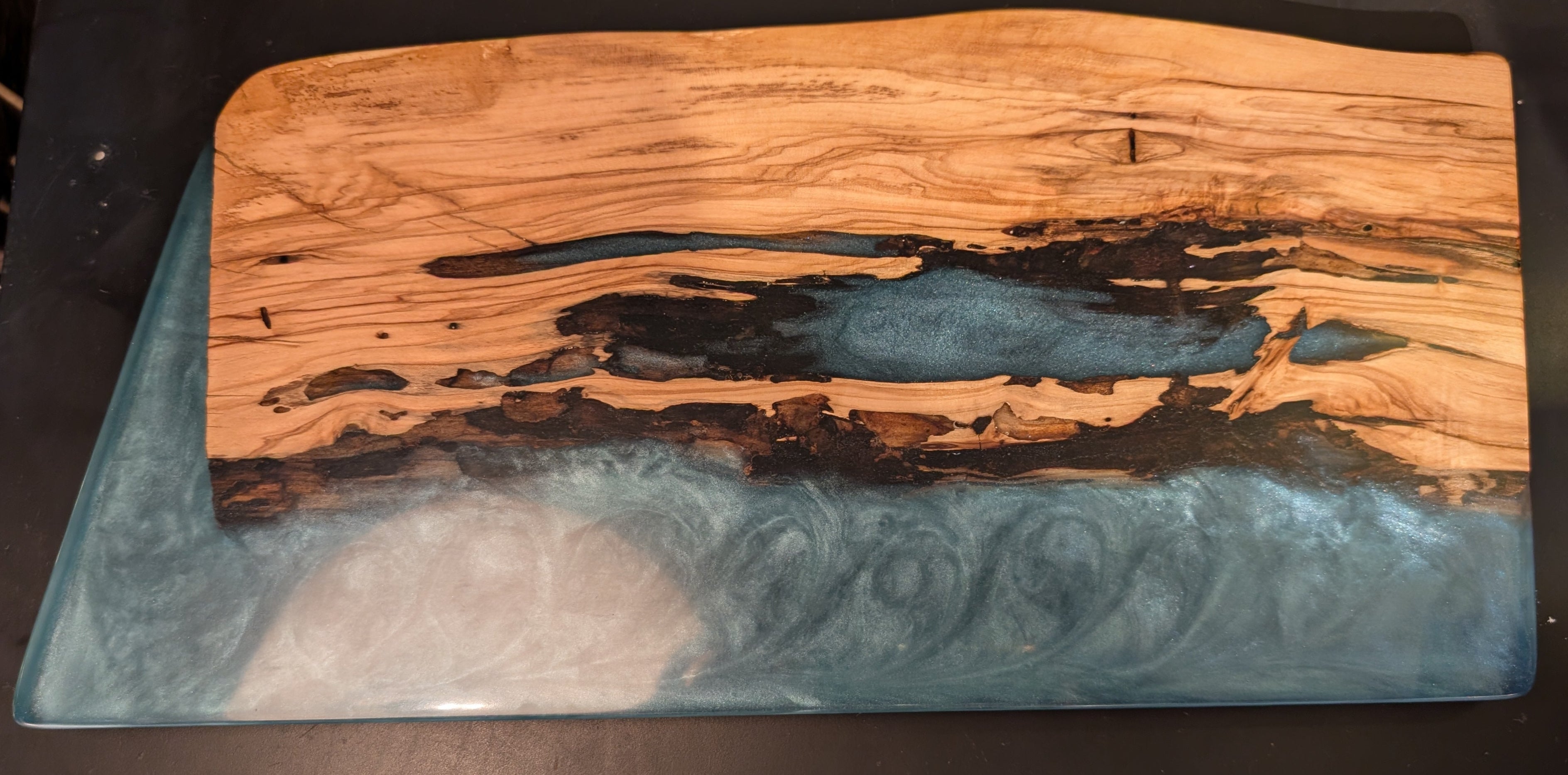 Wooden serving board board with a blue resin design 