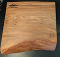 Wooden cutting board on a black 
