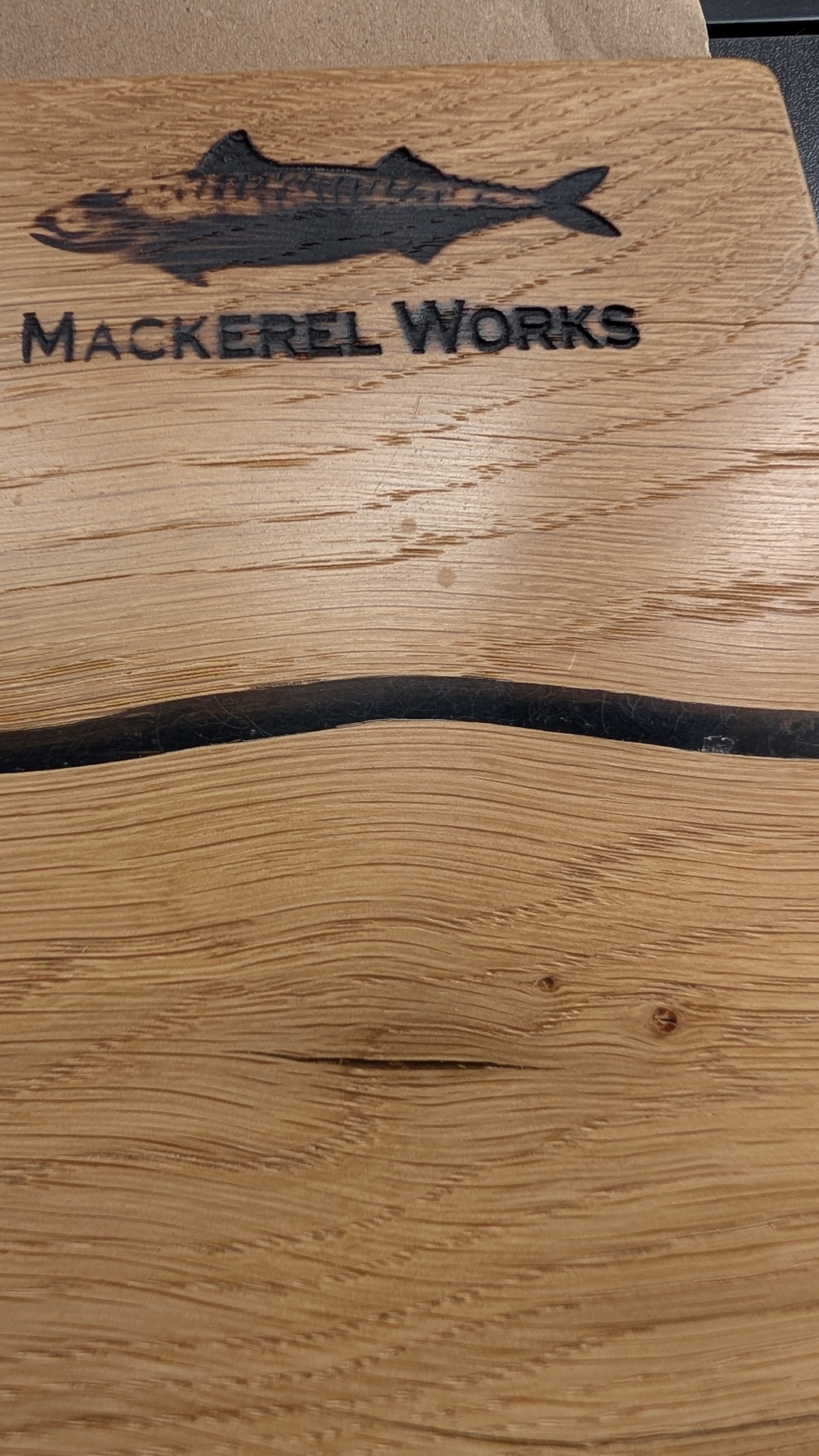 Wooden cutting board with 'Mackerel Works' Branding