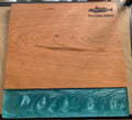 Wooden cutting board with blue resin